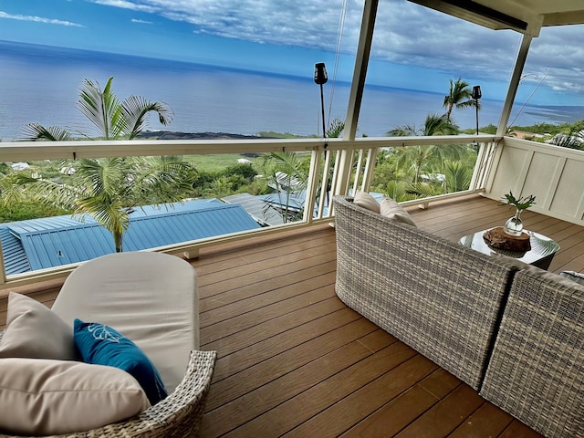 wooden deck featuring a water view