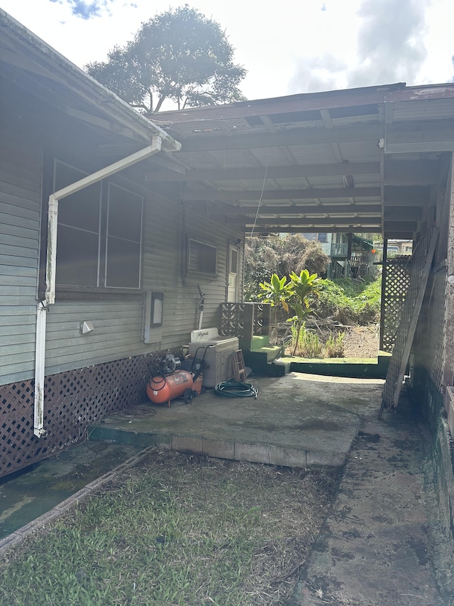 view of parking / parking lot with a carport