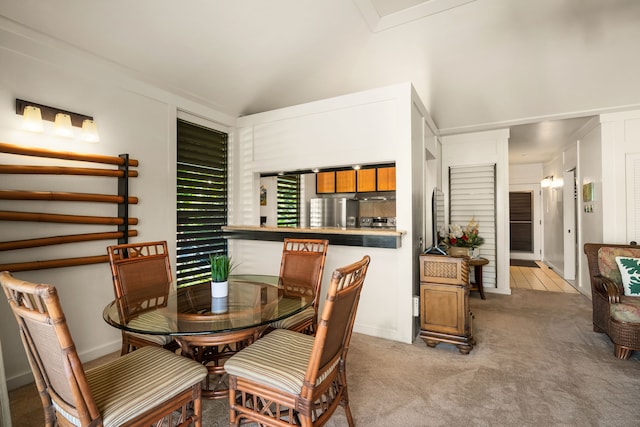 dining space featuring light colored carpet