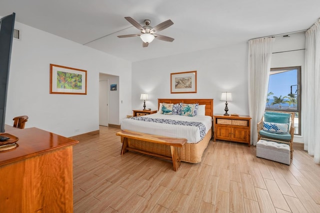 bedroom featuring light wood-type flooring, ceiling fan, and baseboards