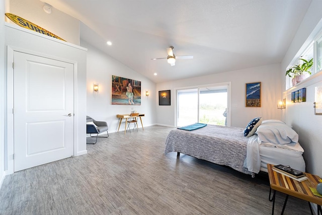 bedroom featuring baseboards, ceiling fan, wood finished floors, access to exterior, and vaulted ceiling