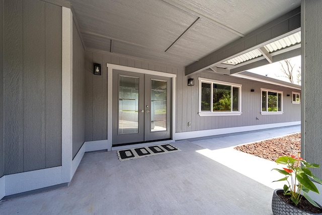 entrance to property with a patio area and french doors