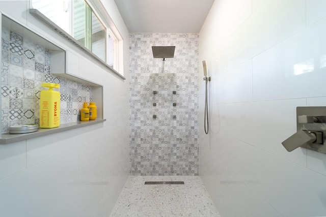 full bathroom featuring tiled shower, tile walls, and decorative backsplash