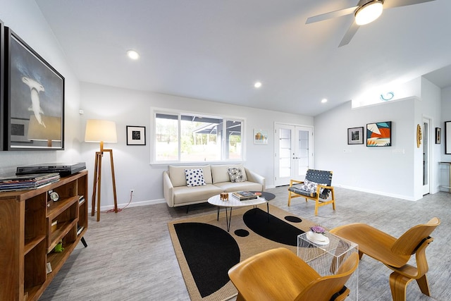 living area featuring lofted ceiling, recessed lighting, light wood-style flooring, ceiling fan, and baseboards