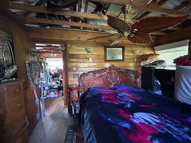 bedroom featuring dark wood-type flooring and wood walls