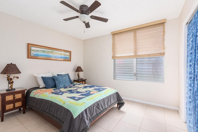 tiled bedroom with ceiling fan