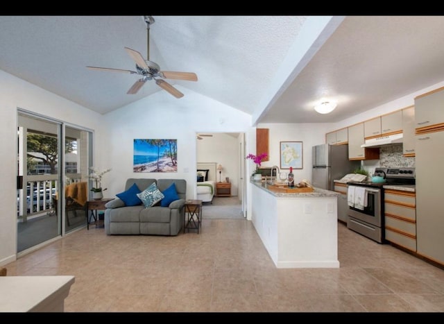 kitchen featuring a ceiling fan, under cabinet range hood, open floor plan, a peninsula, and appliances with stainless steel finishes