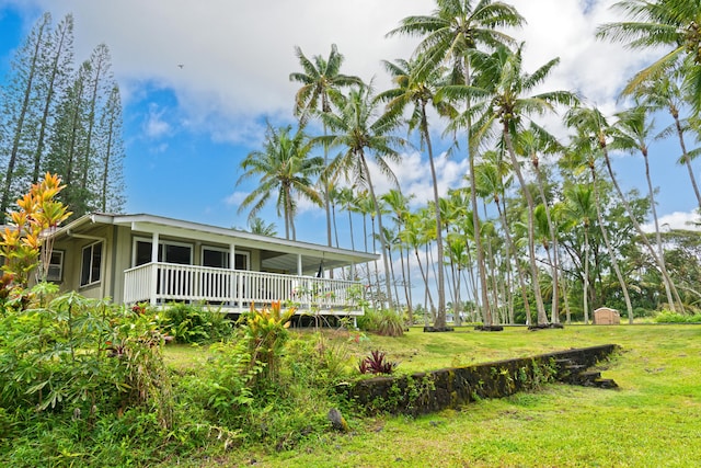 view of yard with covered porch