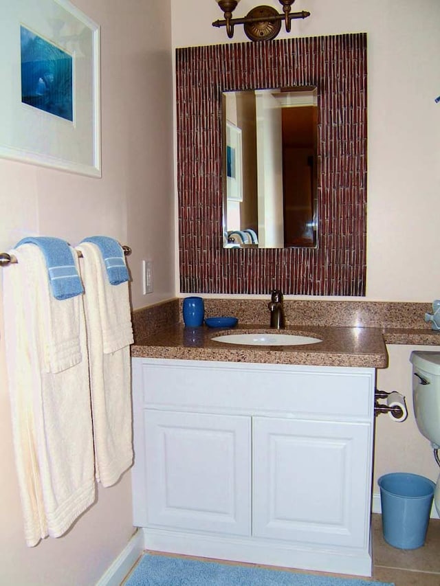 bathroom with tile patterned floors and vanity