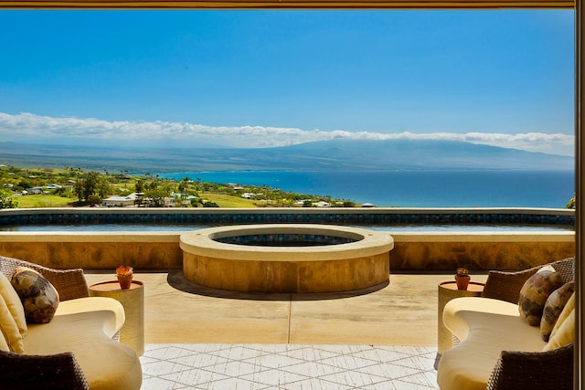 balcony with a water and mountain view