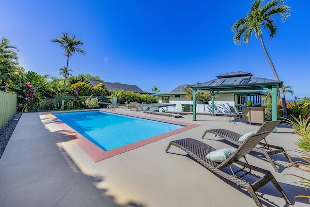 view of swimming pool with a gazebo and a patio