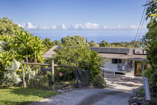 view of front of house with solar panels