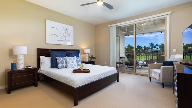 bedroom featuring light carpet, access to exterior, and ceiling fan