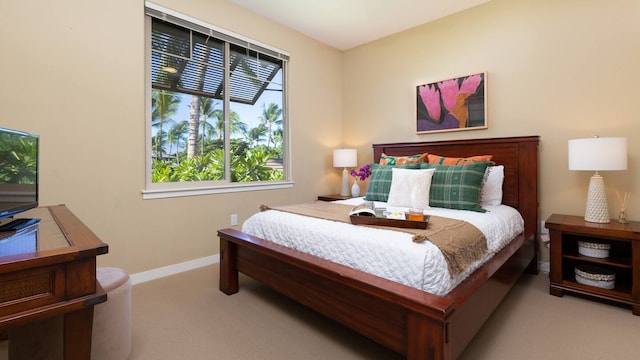 bedroom featuring light carpet