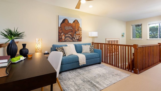 living room with ceiling fan and carpet floors