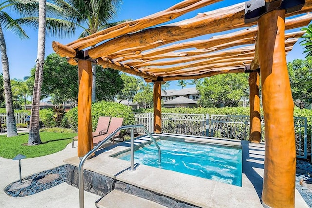 view of pool with an in ground hot tub