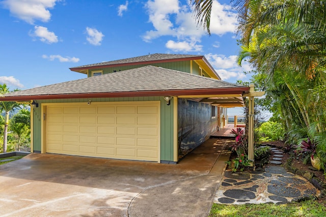 view of side of property with a garage