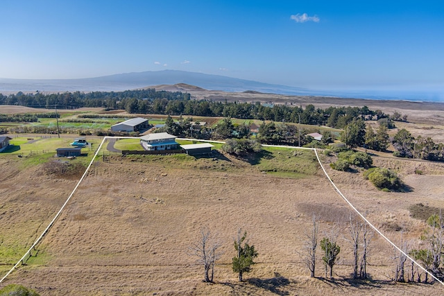 birds eye view of property with a mountain view and a rural view