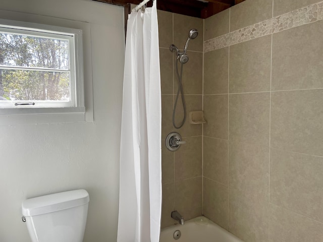 full bathroom with toilet and shower / tub combo