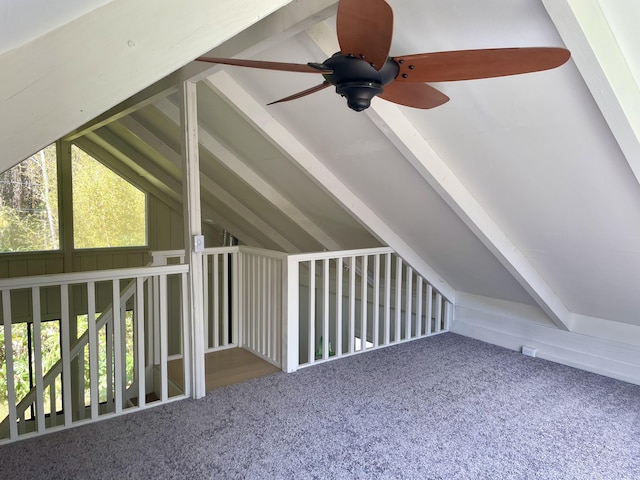 additional living space with vaulted ceiling with beams, carpet, and a wealth of natural light