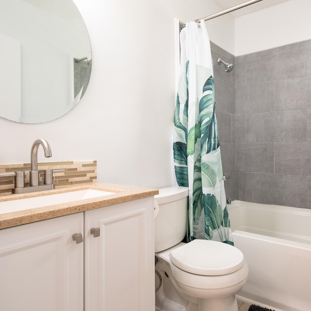 full bathroom with toilet, vanity, and shower / bathtub combination with curtain