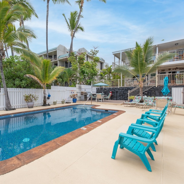 view of swimming pool with a patio