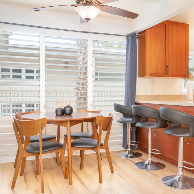 dining area featuring ceiling fan and light hardwood / wood-style floors