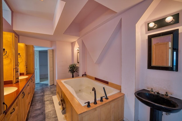 full bathroom with a jetted tub and tile patterned flooring