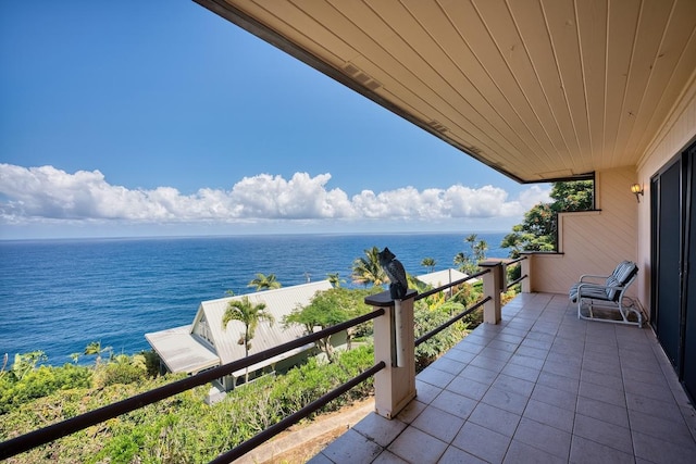 balcony featuring a water view