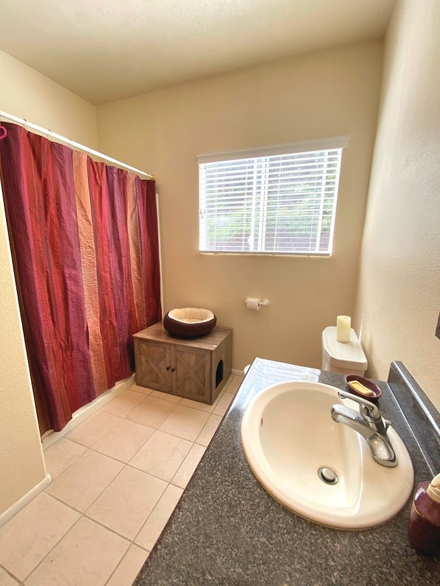 bathroom with sink and tile patterned floors