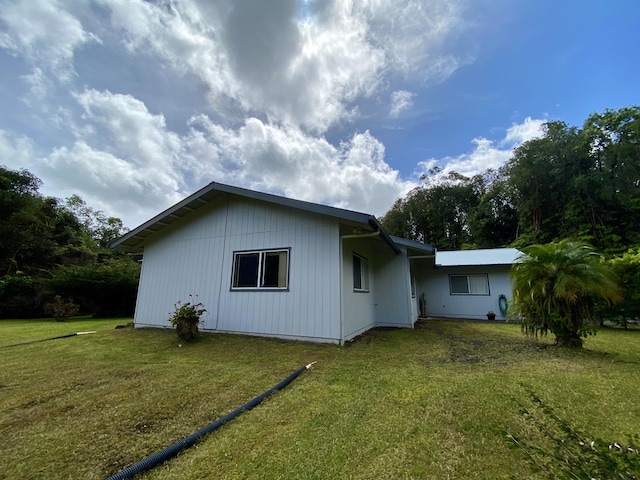 back of house with a yard