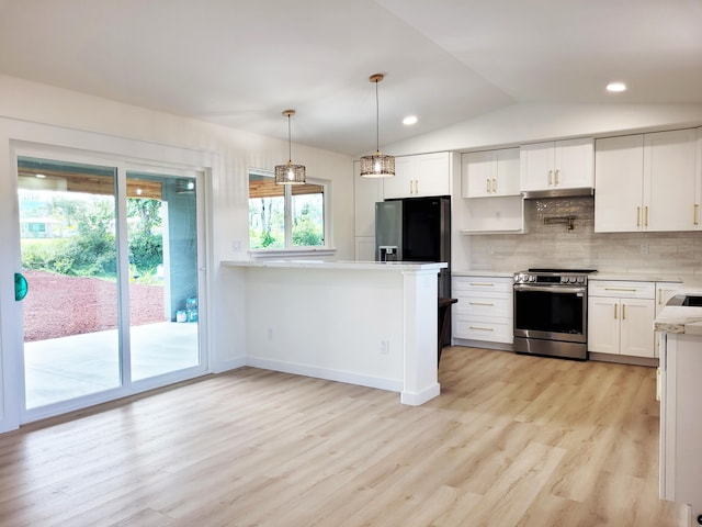 kitchen featuring vaulted ceiling, white cabinets, backsplash, fridge with ice dispenser, and stainless steel electric range