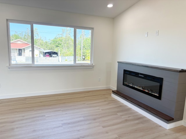 unfurnished living room featuring light hardwood / wood-style floors