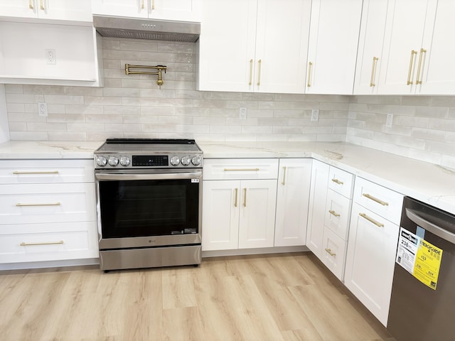 kitchen with white cabinetry, dishwasher, light stone countertops, light wood-type flooring, and stainless steel electric range