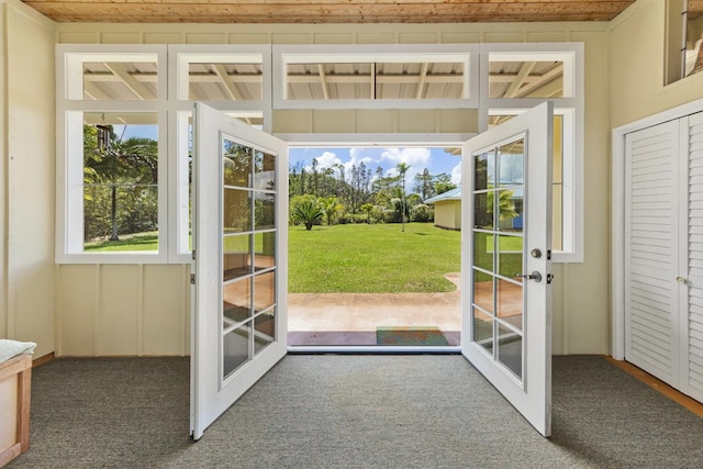 entryway featuring carpet and french doors