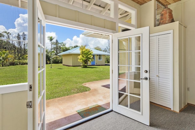 doorway with french doors and carpet