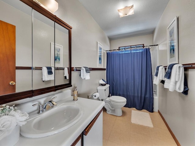 full bath featuring a textured ceiling, tile patterned flooring, toilet, shower / tub combo, and vanity