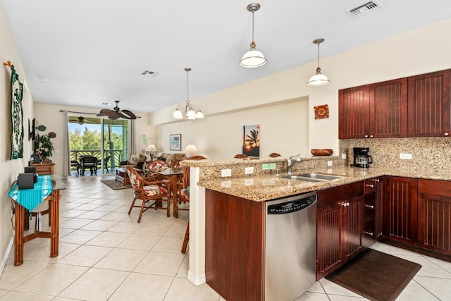 kitchen featuring a sink, tasteful backsplash, visible vents, and dishwasher