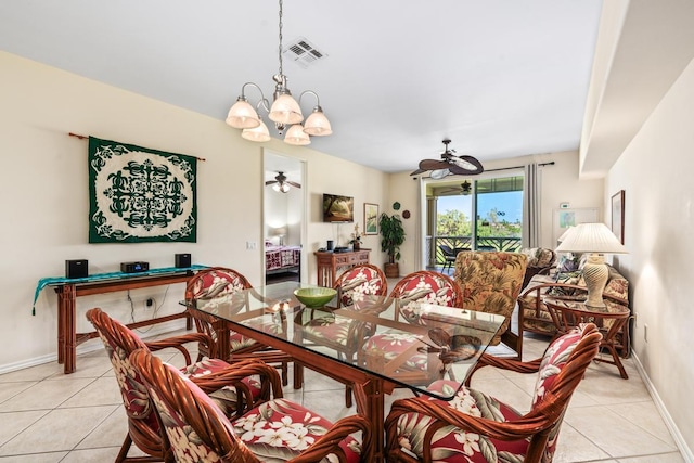 dining area featuring ceiling fan with notable chandelier, visible vents, baseboards, and light tile patterned floors