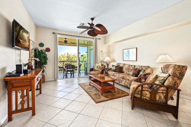 living room featuring light tile patterned floors, baseboards, and visible vents