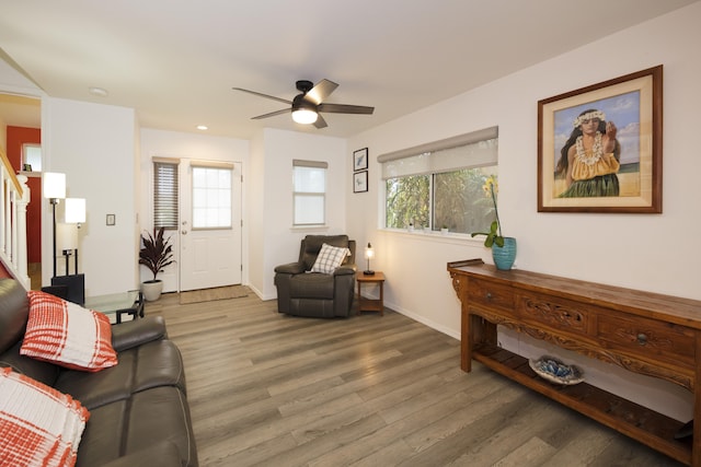 living room featuring ceiling fan, a healthy amount of sunlight, and hardwood / wood-style floors