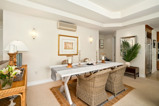 carpeted dining room featuring a tray ceiling and an AC wall unit