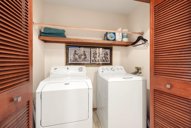 washroom featuring washer and dryer