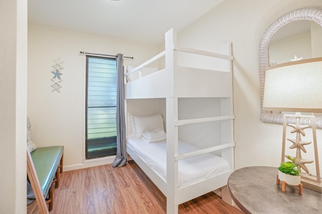 bedroom with wood finished floors