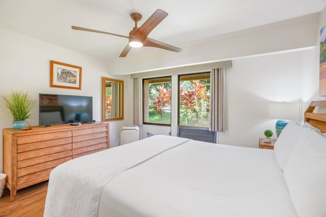 bedroom featuring a ceiling fan and wood finished floors