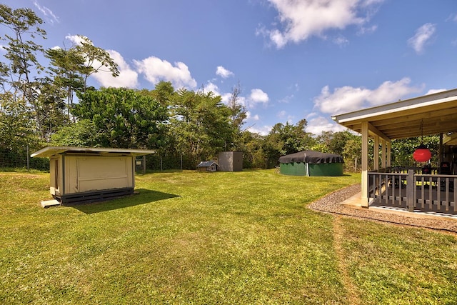 view of yard with a covered pool