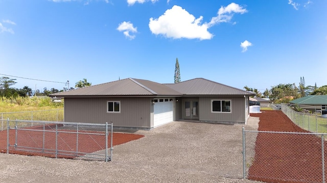 ranch-style home featuring a garage