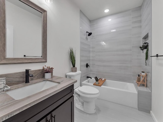 full bathroom with vanity, toilet, and tiled shower / bath