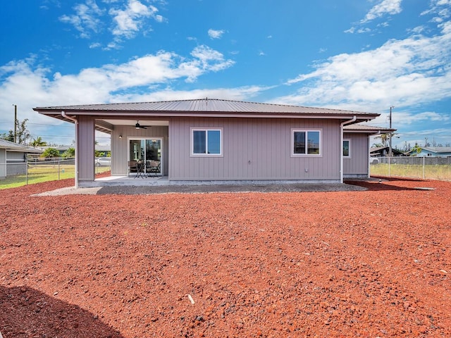 rear view of property with a patio and ceiling fan