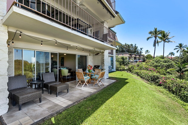 exterior space with a balcony and a patio